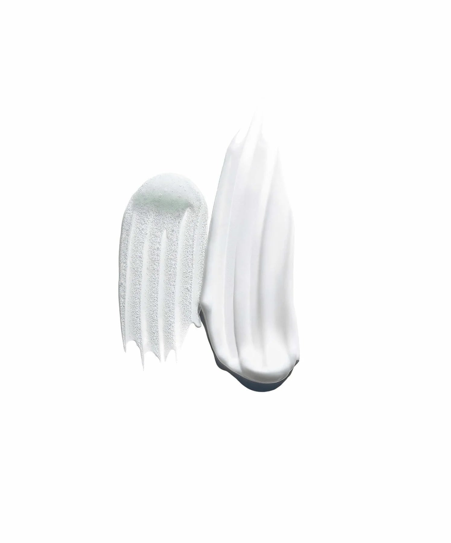 Close-up of a white cream with a comb on a white background