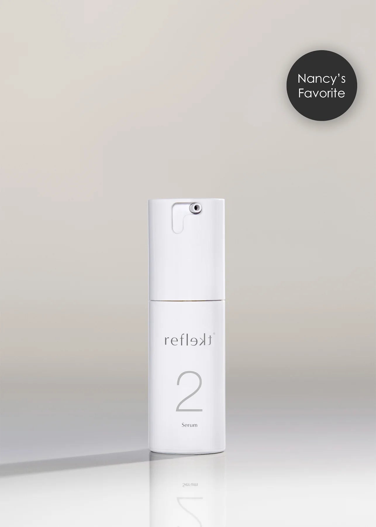 White skincare bottle labeled &