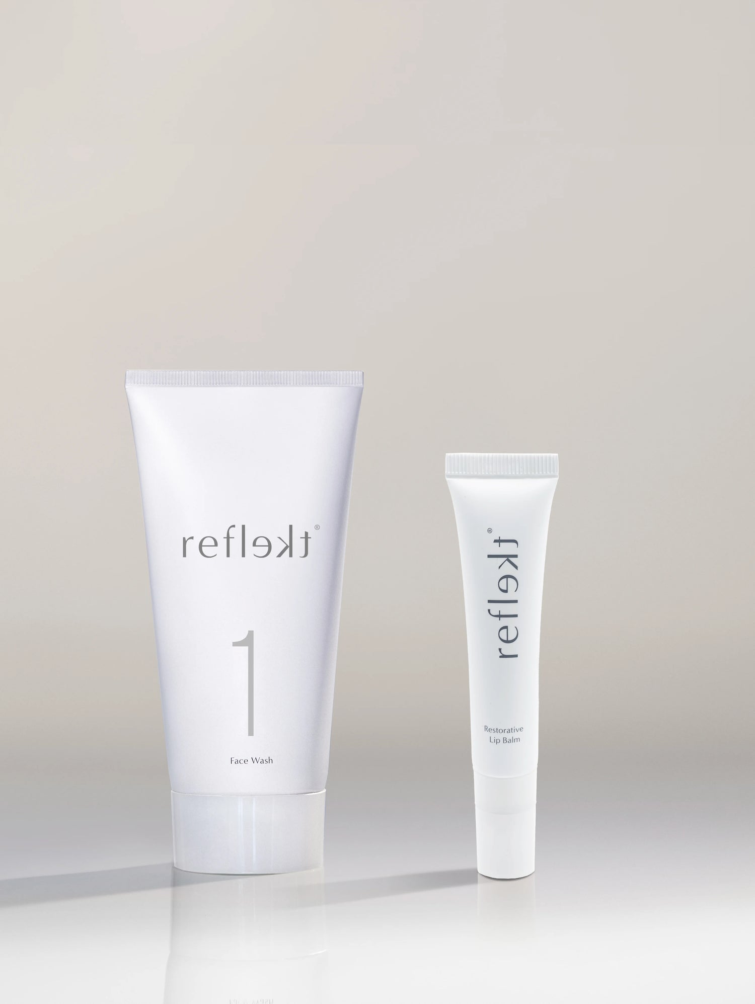 Two white tubes labeled &