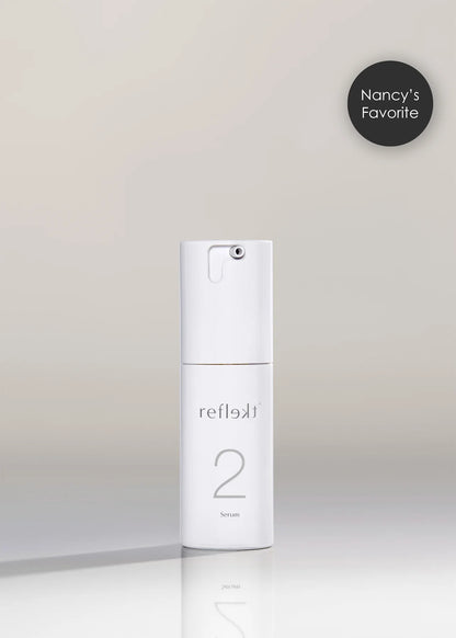 White skincare bottle labeled &